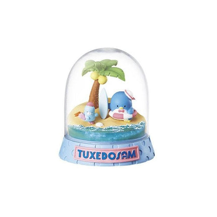 A snow globe containing a miniature beach scene with a blue whale, a surfer, and a palm tree.