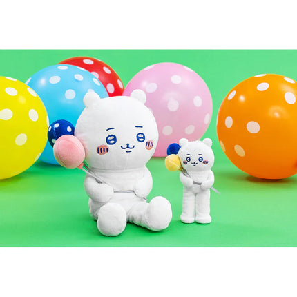 Two mini plush mascots with blue faces and white outfits, surrounded by colorful balloons
