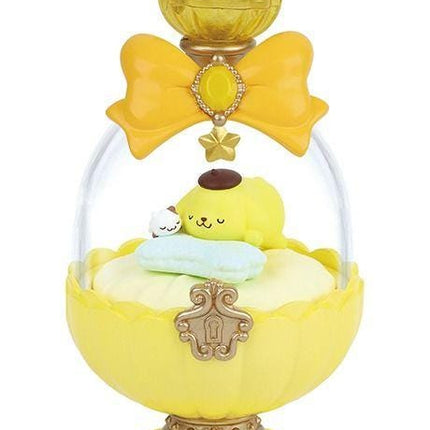 A yellow and gold perfume bottle with a small yellow doll inside, sitting on a yellow flower-shaped base.
