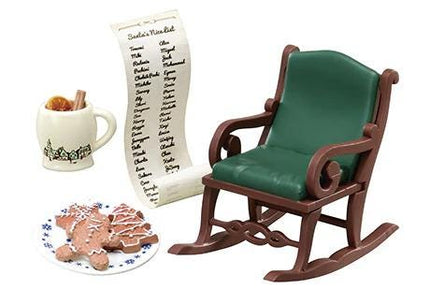 A green rocking chair, a mug with a list of names, a plate of cookies, and a scroll-like paper with a list of names are arranged on a white background.