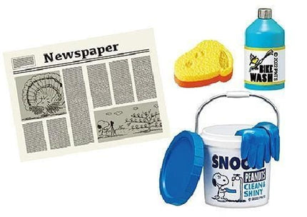 a newspaper, a blue bottle, a yellow sponge, a bucket, and a pair of gloves.