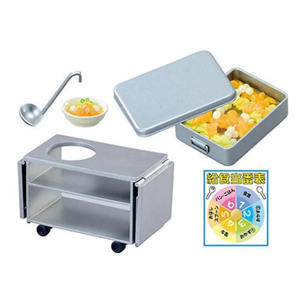 various kitchen utensils and food items, including a spoon, a bowl, a pan, and a small container filled with food. There is also a sign with Japanese text and a wheeled cart.