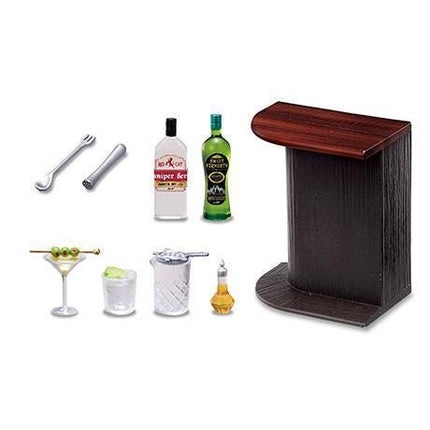various items related to cocktails and drinks, including a wooden bar, bottles of alcohol, a martini glass, a cocktail shaker, a salt shaker, a lemon wedge, and a spoon.