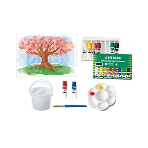 various art supplies, including a watercolor painting kit, a paint palette, a paintbrush, and a cup.