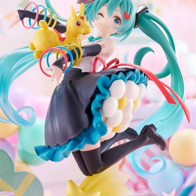Collectible anime figure side view with teal twin-tails, black outfit, blue flower trim, Rody