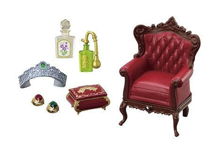 a variety of objects, including a red leather armchair, a tiara, a perfume bottle, a box, and a ring.