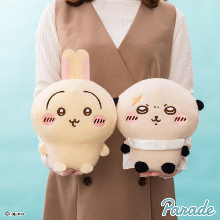 Super fluffy plush toy pair held in hands: cream bunny-faced plush and white/black bear-faced plush