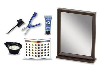 various hair care and beauty products, including a mirror, a hair coloring tray, a hairbrush, and a tube of hair product.