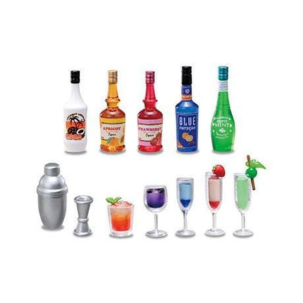 A collection of various alcoholic beverage containers and glasses, including bottles, a shaker, a martini glass, a wine glass, and a cocktail glass, arranged in a row.