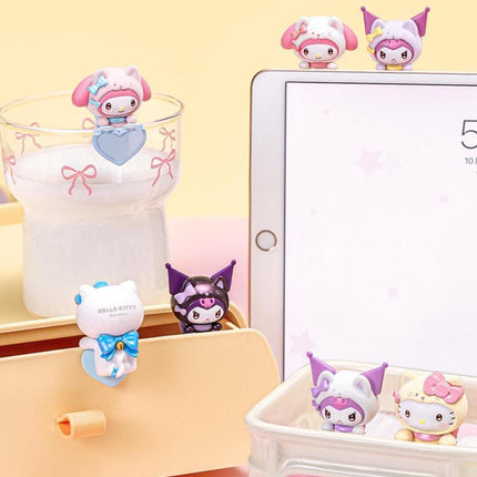 May include: A collection of Hello Kitty and My Melody character figurines in various poses. The figurines are in a variety of colors, including pink, white, and purple. Some are attached to a glass, a tablet, and a drawer.
