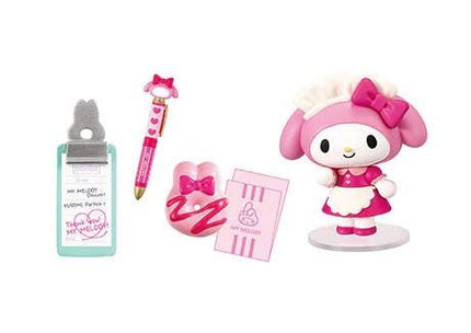 a Hello Kitty figurine, a pen, a donut, and a card.