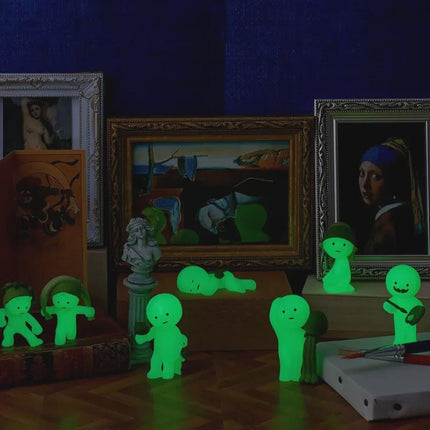 a collection of illuminated figurines and framed artworks, creating a visually striking and unique display.