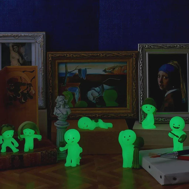 a collection of illuminated figurines and framed artworks, creating a visually striking and unique display.