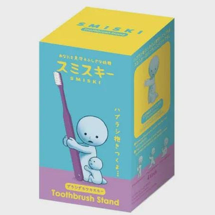 The image is a box containing a toothbrush stand with a cartoon character holding a toothbrush.