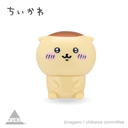 Cream mini character figure with smiling face and small paws, front view