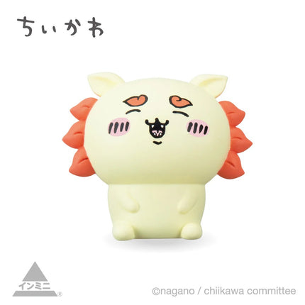 Cream mini character figure with orange side spikes and heart eyes, standing