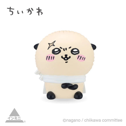Interior mini figure, cream panda-like character with black patches, sitting