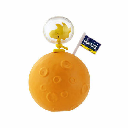 Astronaut capsule toy with clear helmet on yellow ball base, small trophy and label