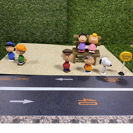 Group of PEANUTS capsule toy figures, including Snoopy and multiple characters