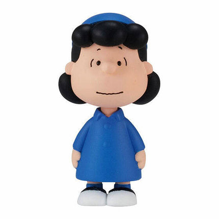 PEANUTS capsule toy figure of a boy in a blue outfit with white shoes