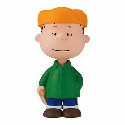 PEANUTS capsule toy figure of a boy in a green shirt and brown shoes