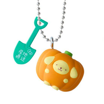 Vegetable charm keychain with orange face in vegetable shape, green accents, silver chain