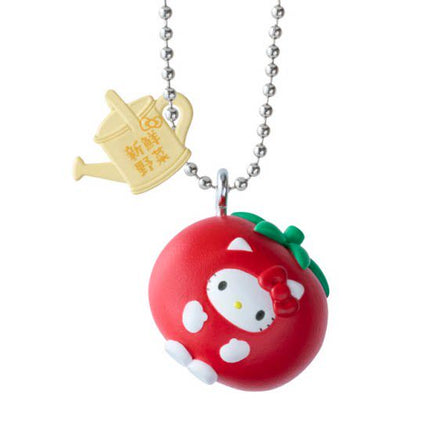 Red tomato Hello Kitty-style charm keychain with green bow and silver ball chain