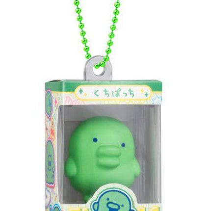 Green character gumiture charm in box with green beaded keychain