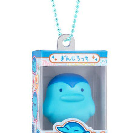 Bandai Tamagotchi gumiture charm with blue whale character in boxed package and turquoise bead necklace