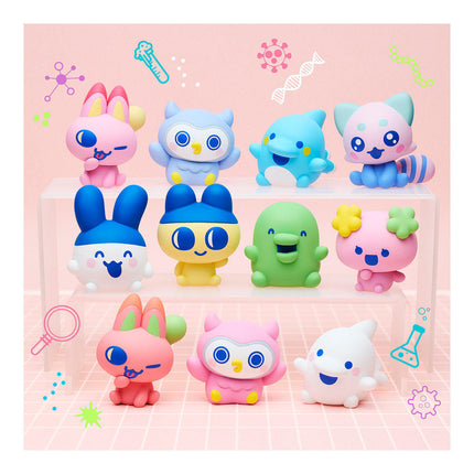 Set of assorted soft vinyl character figures displayed on a pastel pink backing