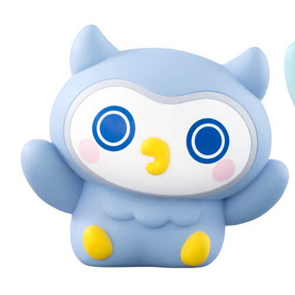 Light blue soft vinyl figure with big round eyes on a visor and yellow nose