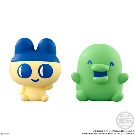Two soft vinyl character figures: blue-and-yellow bunny and green blob mascot