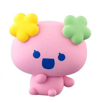 Soft vinyl character figure in pink with blue face markings and flower-like arms