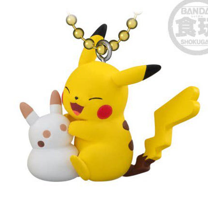 Yellow Pikachu mascot keychain hugging white biscuit character, eyes closed