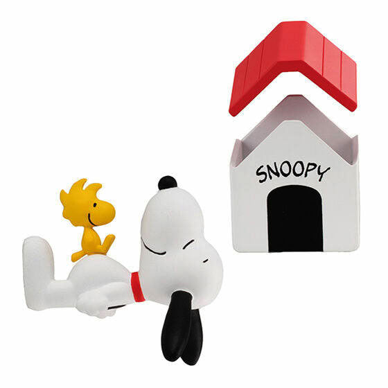 Snoopy figurine with small yellow bird figure and white house accessory