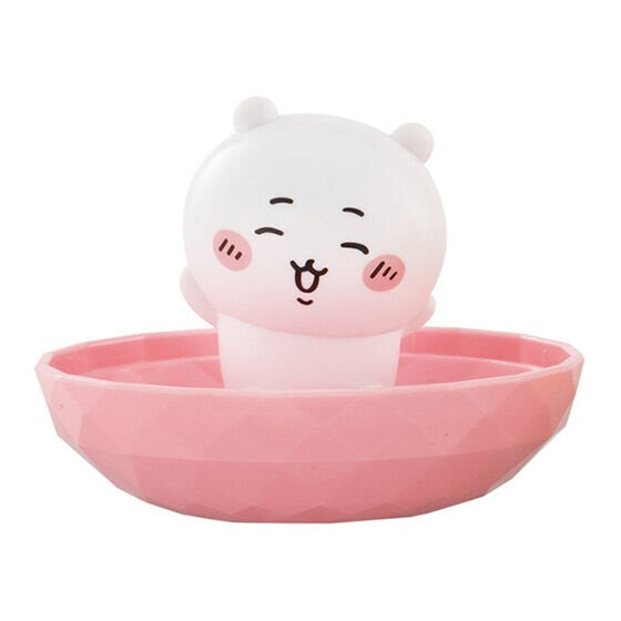Pink animal face jewelry stand with round tray and blushing cheeks, compact design