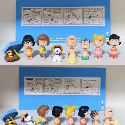 Peanuts capsule toy set with eight mini character figures, displayed in two rows