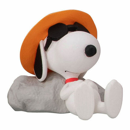 Peanuts Snoopy mini figure in orange hat, holding a gray blanket