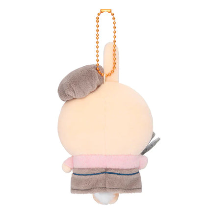 Cream bakery staff mascot plush from back with orange beaded necklace and side details