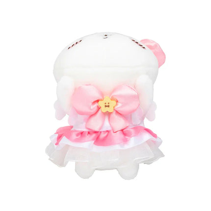 Front view plush mini mascot with pink flower accent and layered ruffle skirt.
