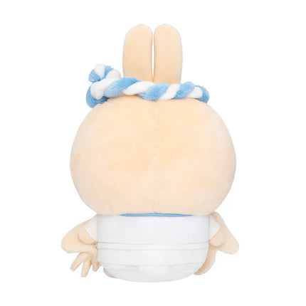 Back view light tan sushi trainee plush with blue braided hat and white outfit