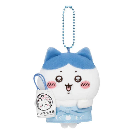 Plush mascot holder with blue beaded chain, white body with blue hood and small bag charm