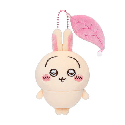 Plush bunny mascot with pink ear cap and long bead necklace, front view
