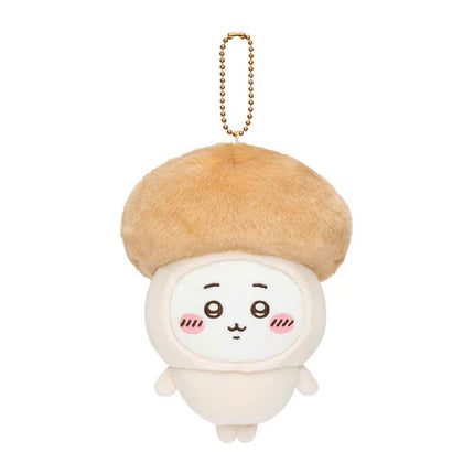 Single seasonal plush keychain with tan beret, white face, and gold bead chain