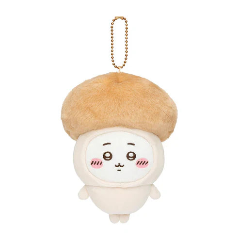 Single seasonal plush keychain with tan beret, white face, and gold bead chain