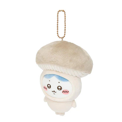Plush mascot keychain: white character with cream ribbed cap, gold chain, blue-tinted face