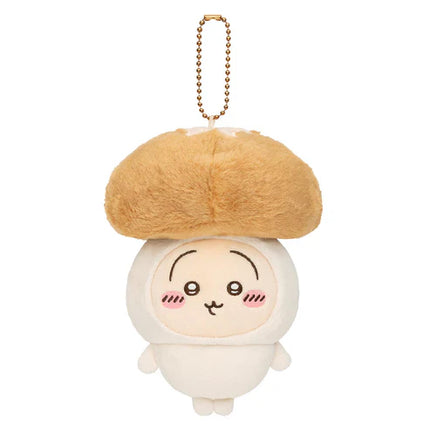 Plush mascot keychain: white character with tan beret-style cap, gold chain and face