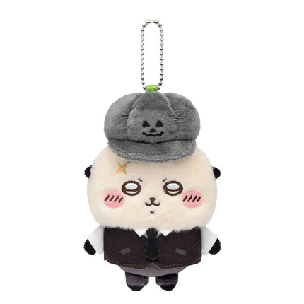 Plush mascot keychain with gray beanie hat, white face, black outfit, silver chain