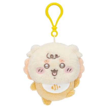 Plush mascot keychain with cream face and yellow clip, rounded ears and blush