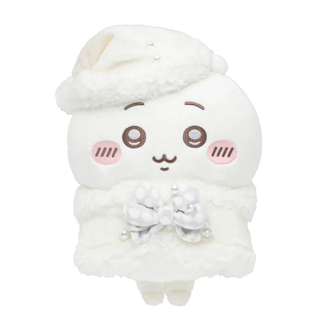 White plush character with smiling face, soft ruffled outfit, and small bow at chest.
